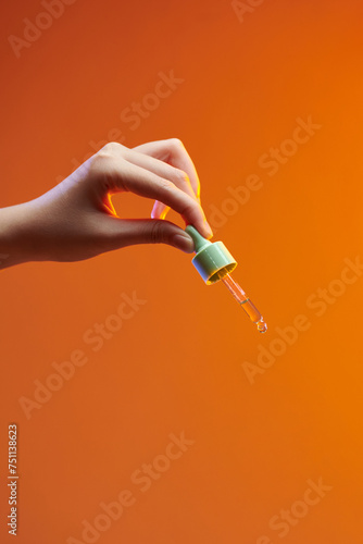 Pipette dropper with a drop of natural oil photo