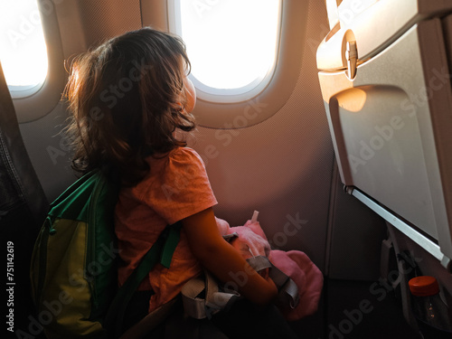 Travel with kids on plane for vacation photo