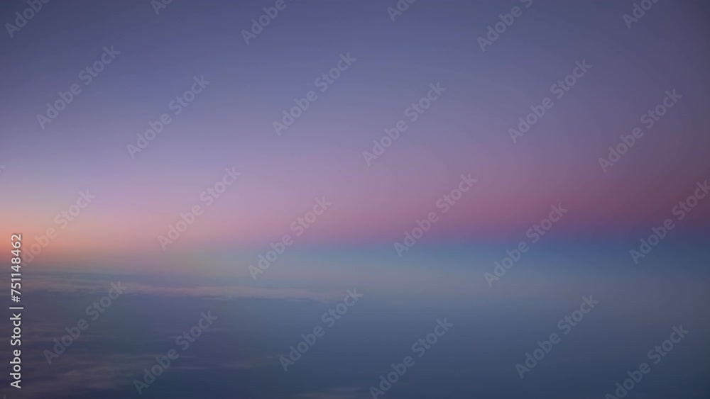 Dreamlike ethereal view of sunset from aircraft window