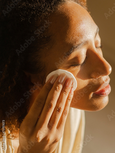 Removing make-up using cotton pad