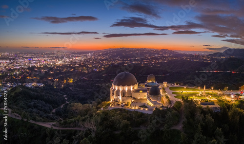Griffith Observatory and city of Los Angeles skyline panorama at dusk. Aerial view.