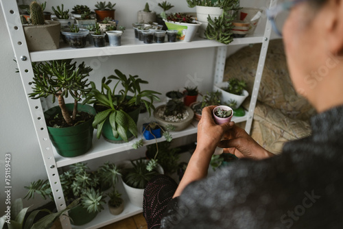 Woman Taking Care Of Plants Indoors