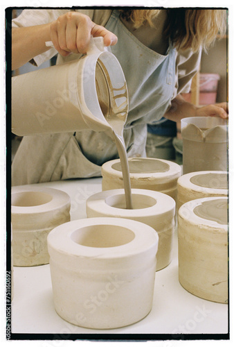 Ceramist working at pottery studio photo