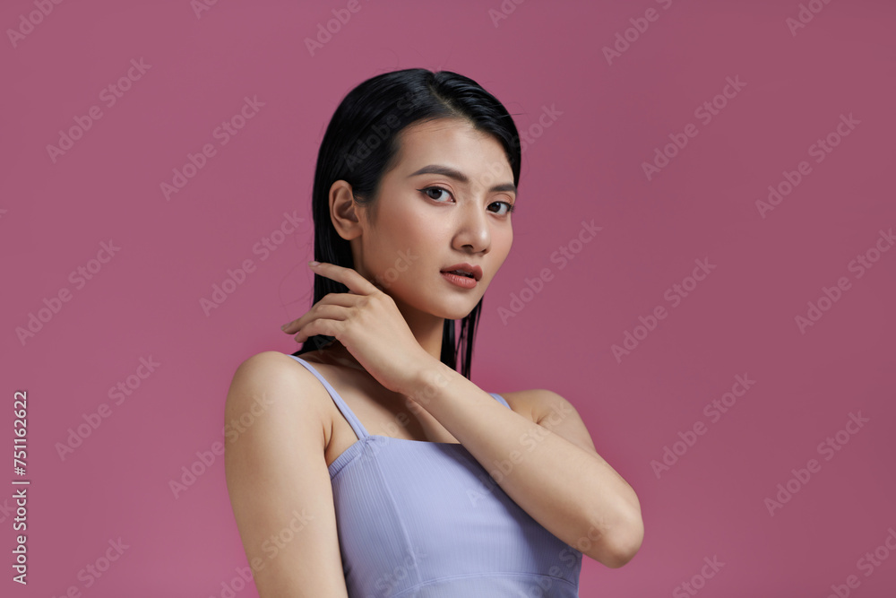 An attractive young woman with fresh skin and wet hair An attractive young woman with fresh skin and wet hair