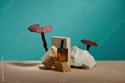 bottle with an essential oil pipette on a podium made of stone photo