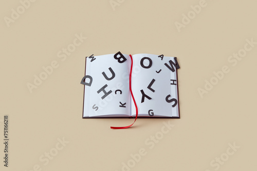 Blank book with red bookmark and black letters. photo