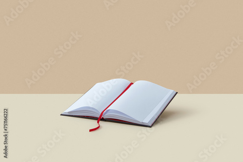Open blank book with red bookmark. photo