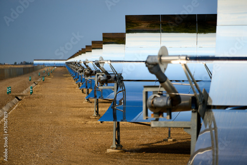 Renewables - parabolic trough solar collector mirror heliostats photo