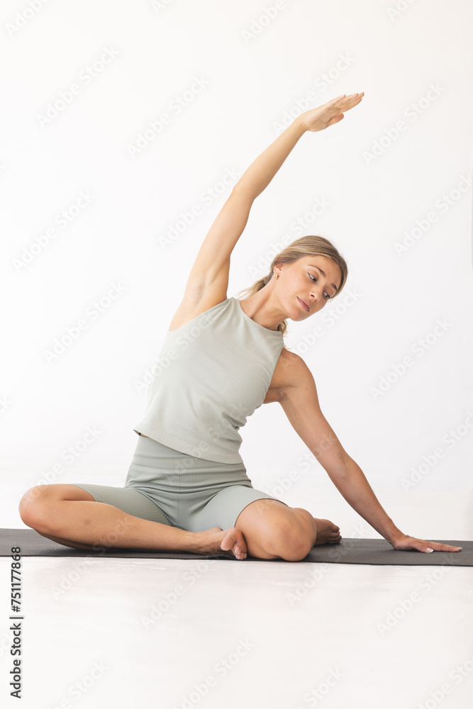 Young Caucasian woman practices yoga in a serene indoor setting with copy space Young Caucasian woman practices yoga in a serene indoor setting with copy space