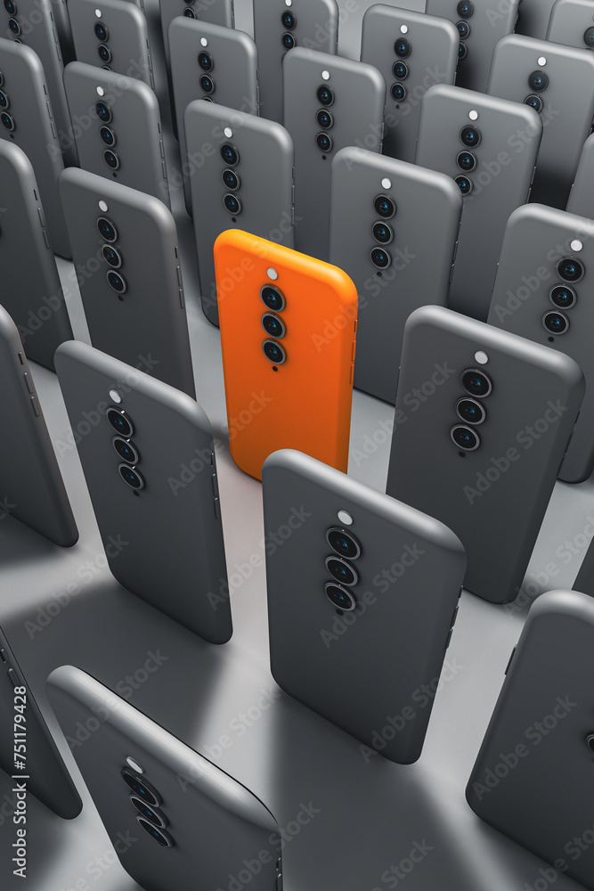 Obraz premium Unique orange smartphone amongst black phones