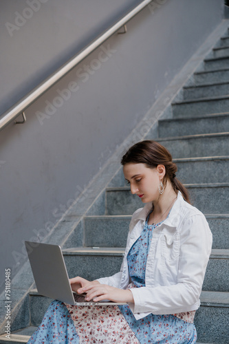 Beautiful Asian business woman reading document outdoors