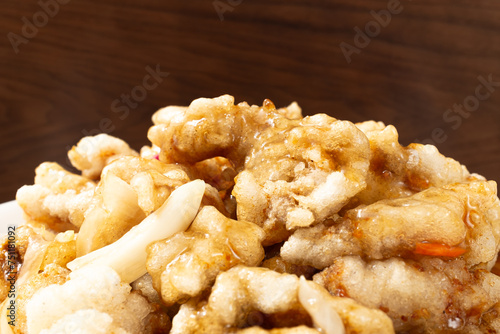 Chinese food with fried pork and sweet and sour sauce photo