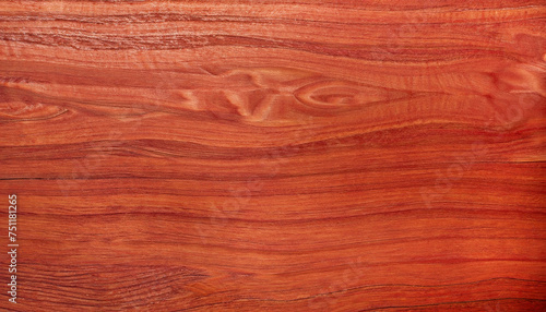 the background of red polished wood texture with a beautiful pattern; close-up