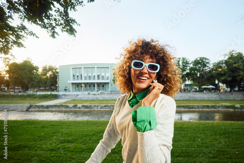 Portrait of a smiling woman having a phone call photo