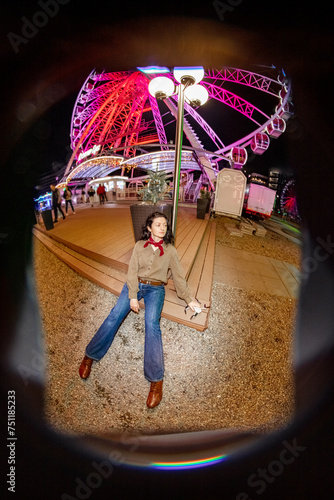 A girl smiles with a quadcopter near the evening rides