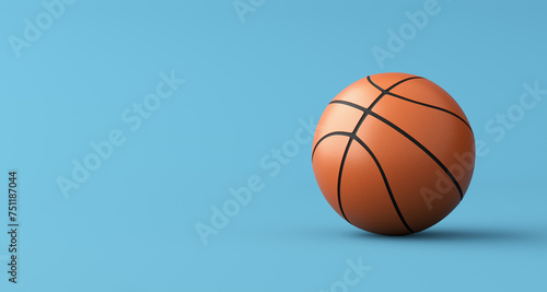 Basketball on blue background with copy space. © Cagkan