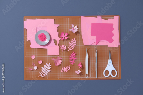 Top view over paper cut tools, scissors, cutter, cutting mat photo