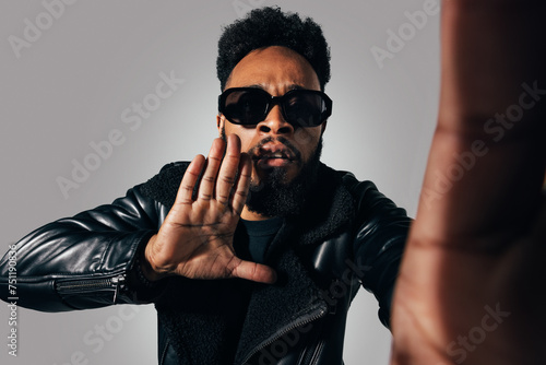 Black black man making gestures with hands to camera photo