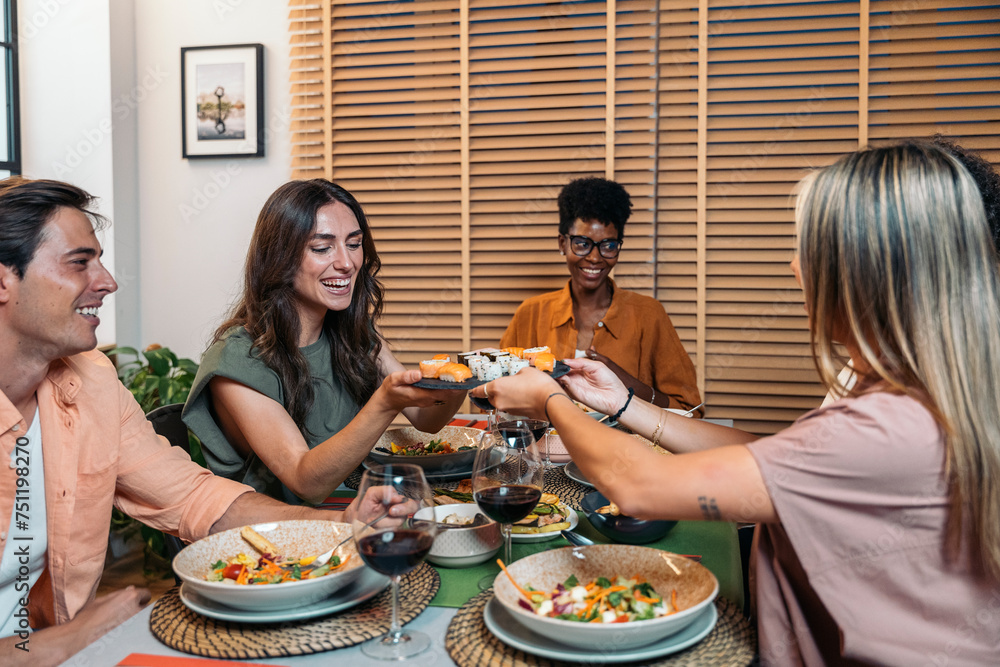Diverse Friends Having Dinner at home While chatting Diverse Friends Having Dinner at home While chatting