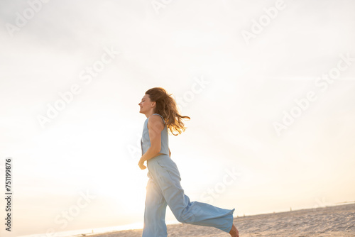 Woman Running In The Beach photo