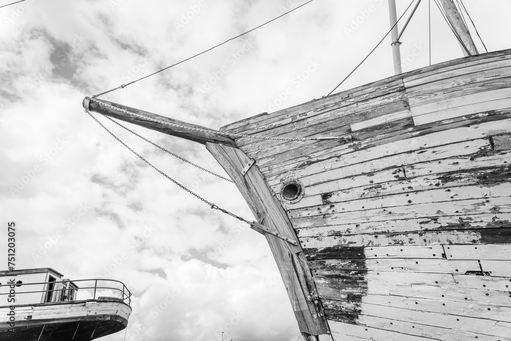 Old derelict wooden ship wreck black and white closeup. Front part of ...