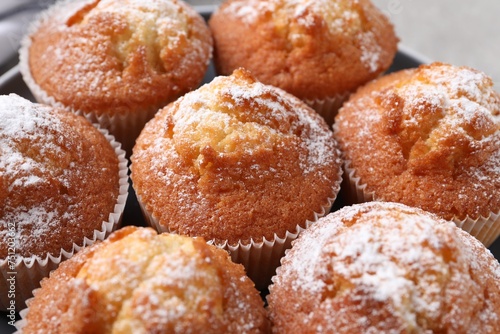 Delicious sweet muffins on table, closeup view