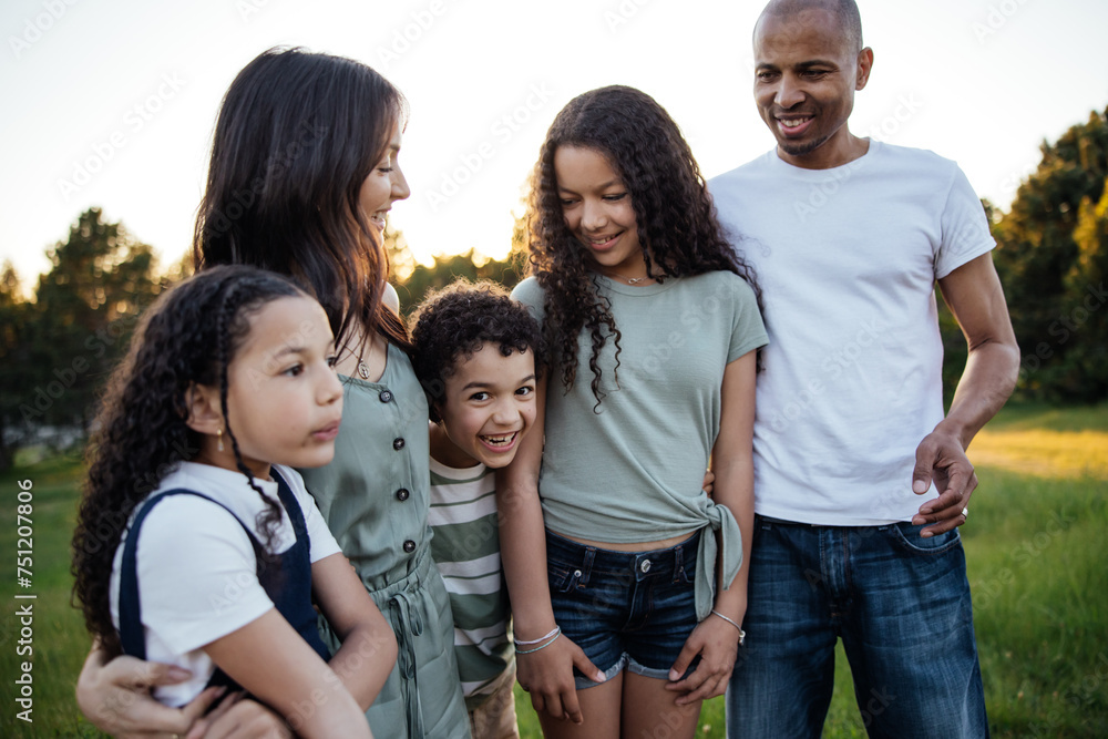 Group family portrait outside in nature at sunset. Group family portrait outside in nature at sunset.