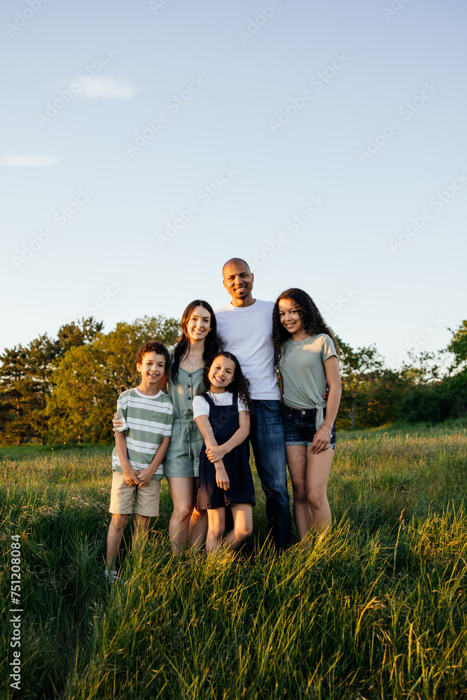 Group family portrait outside in nature at sunset. Group family portrait outside in nature at sunset.