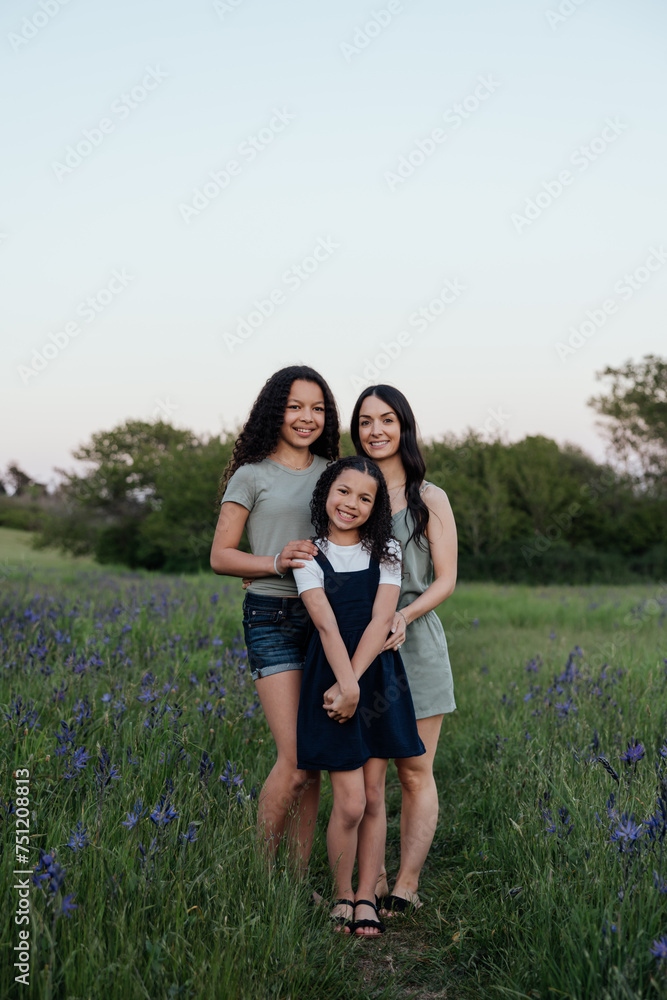 Mom and daughters enjoying time together outside. Mom and daughters enjoying time together outside.