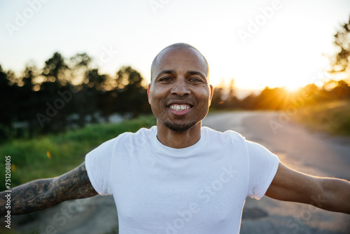 Natural sunset portraits of man in plain t-shirt. 