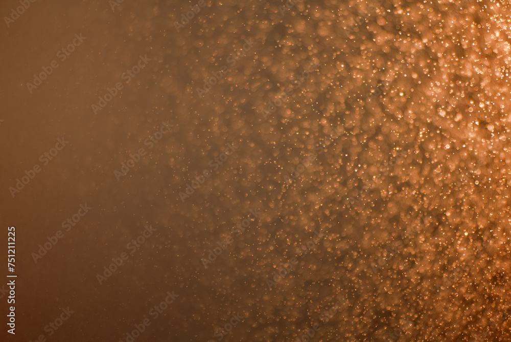 Abstract orange-brown background with bright splashes and light gradient Abstract orange-brown background with bright splashes and light gradient