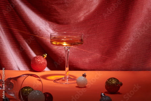 wineglass with accessories on velvet curtain background photo