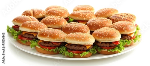 A white plate is filled with a stack of delicious hamburgers, each topped with fresh ingredients. The burgers are neatly arranged and look tempting for a hearty meal.