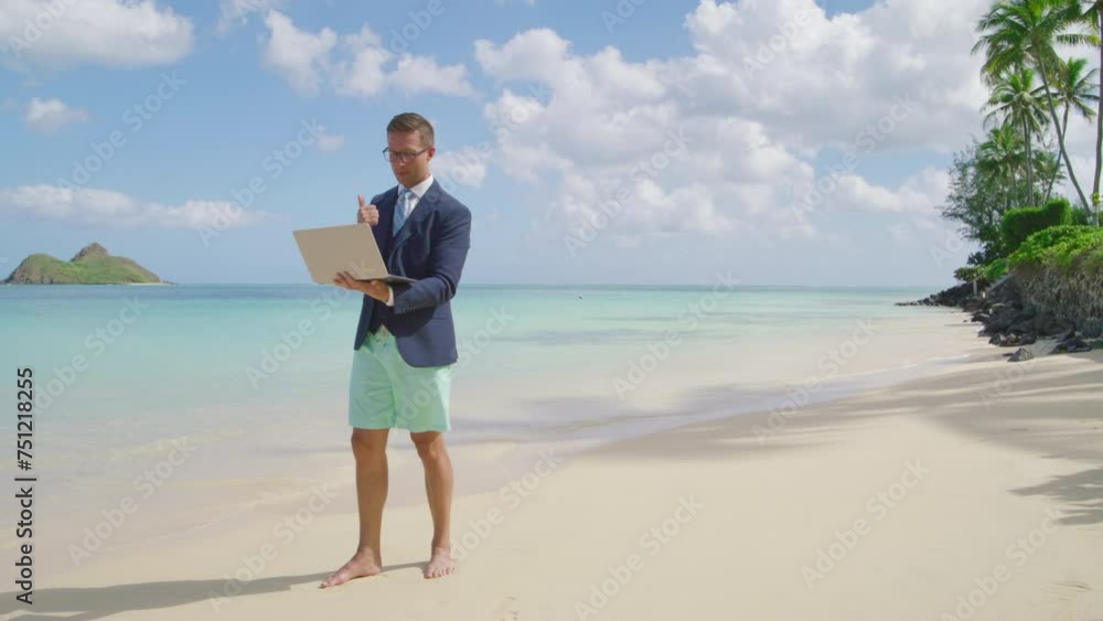 Young successful businessman in glasses, barefoot working remotely, surrounded by the breathtaking view of the oceanic landforms and coastal palm trees. High quality 4k footage Young successful businessman in glasses, barefoot working remotely, surrounded by the breathtaking view of the oceanic landforms and coastal palm trees. High quality 4k footage