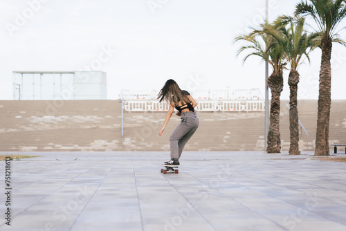 Woman velocity skating in the city photo