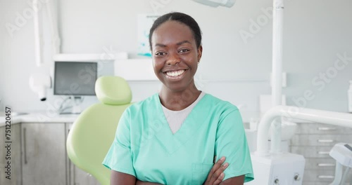 Face, dentist and arms crossed with black woman in scrubs at hospital for dental care or oral hygiene. Portrait, smile for healthcare and happy young orthodontist professional at clinic for dentistry photo