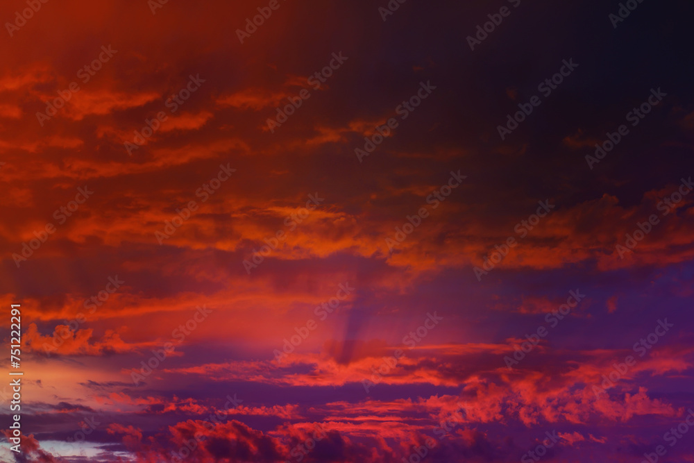 Beautiful sunset sky above clouds with dramatic light. Cabin view from airplane