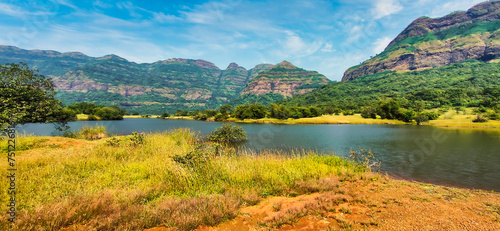Panoramic view of beautiful Mulshi dam backwaters on a sunny day.