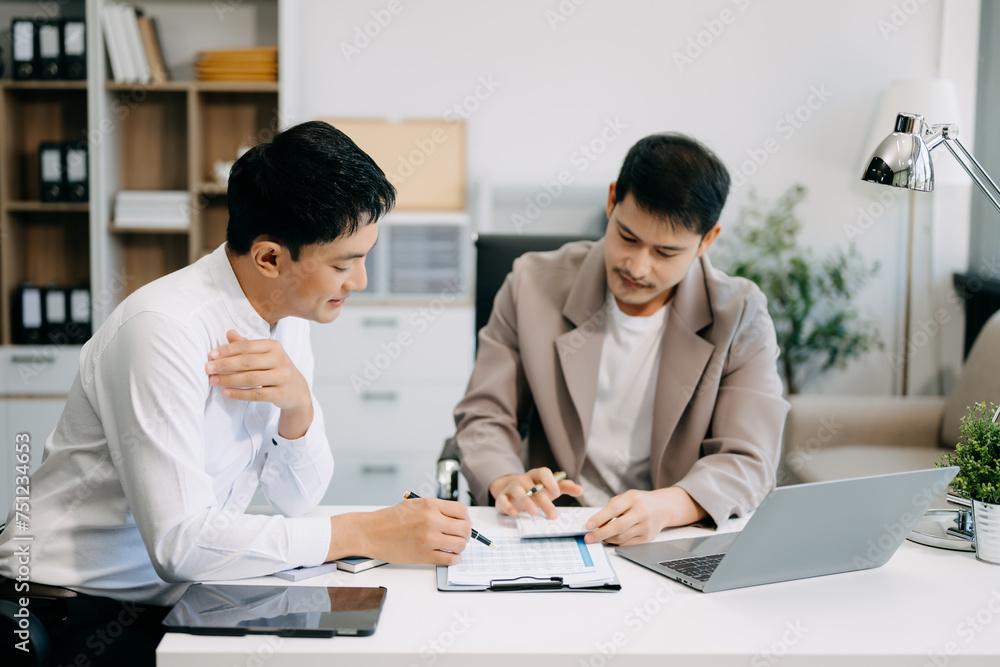 Portrait of success business people working together in office. Couple teamwork startup concept.. Portrait of success business people working together in office. Couple teamwork startup concept..