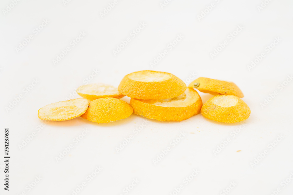 Freeze-dried kumquats on a solid color background Freeze-dried kumquats on a solid color background