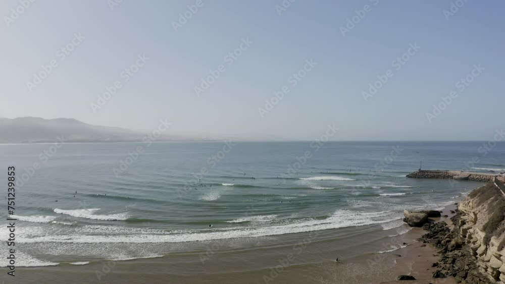 Aerial Video of Surfers Paddling and Surfing Over Crashing Waves at Atlantic Ocean. Aerial Video of Surfers Paddling and Surfing Over Crashing Waves at Atlantic Ocean.