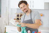 young man washing dishes