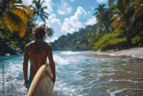 Asian man with surfboard standing on sea sand beach © sofiko14