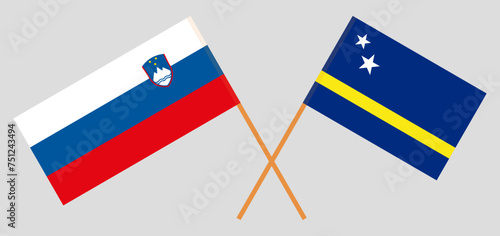 Crossed flags of Slovenia and Country of Curacao. Official colors. Correct proportion