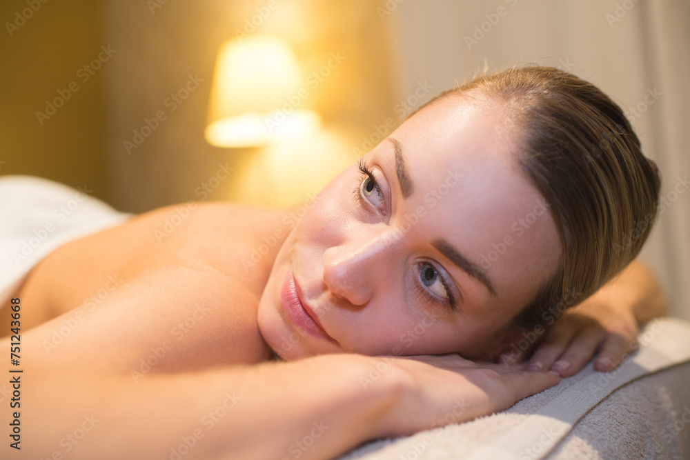 woman relaxing after a massage session woman relaxing after a massage session
