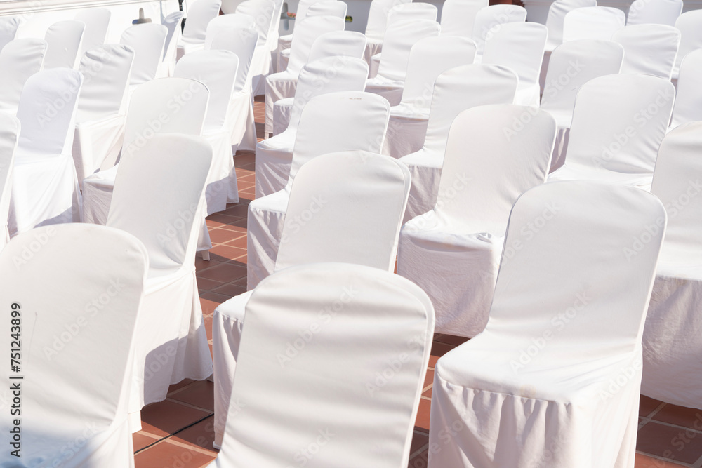 Fototapeta premium Many chairs with white elegant covers 