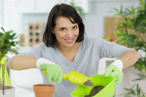 female emloyee with gardening supplies photo