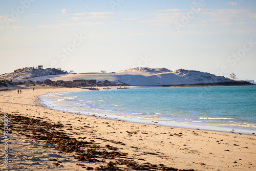 Fototapeta Naklejka Na Ścianę i Meble -  Panorama in Mamirano bay, a white dune in the background with a Vezo village. Tulear, Madagascar