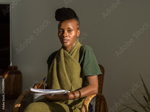 Young African American linguist with notepad photo