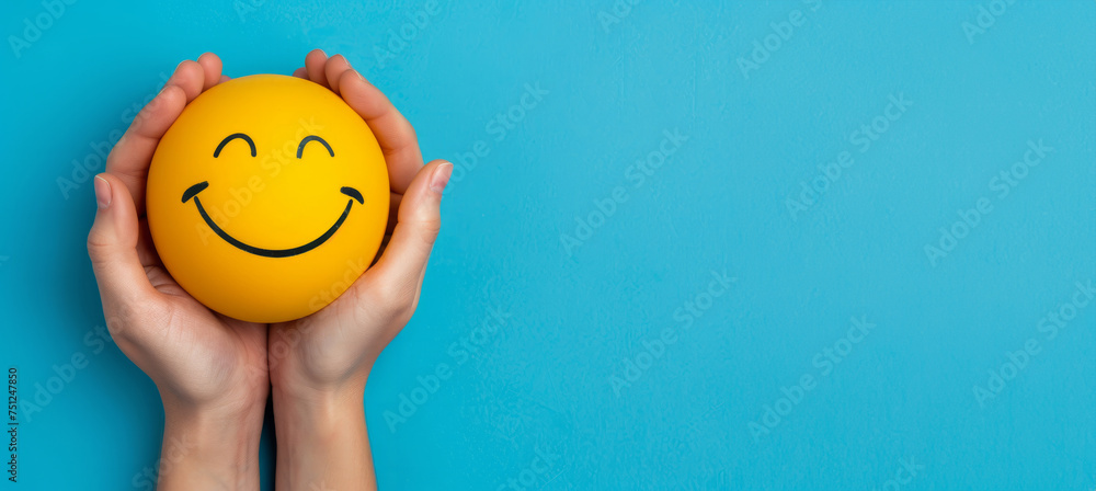 Hand holding happy smile face and sad paper cut, Positive thinking, Mental health assessment , World mental health day concept. A person is holding two smiley faces in their hands. faces are smiling Hand holding happy smile face and sad paper cut, Positive thinking, Mental health assessment , World mental health day concept. A person is holding two smiley faces in their hands. faces are smiling